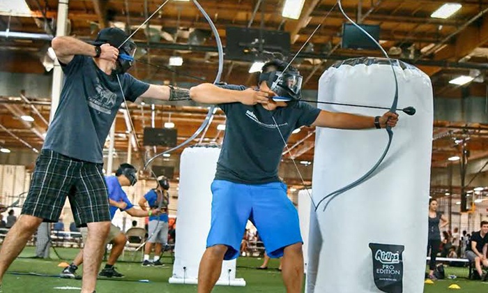 Archery Tag players with bows drawn